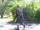 Scottish Bagpipe Player Walks the Grounds