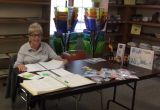 Becky Runs the Quilting Booth